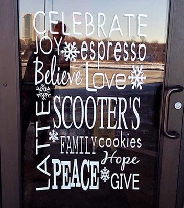 A Scooters Coffee entrance with the words celebrate, joy, believe and peace
