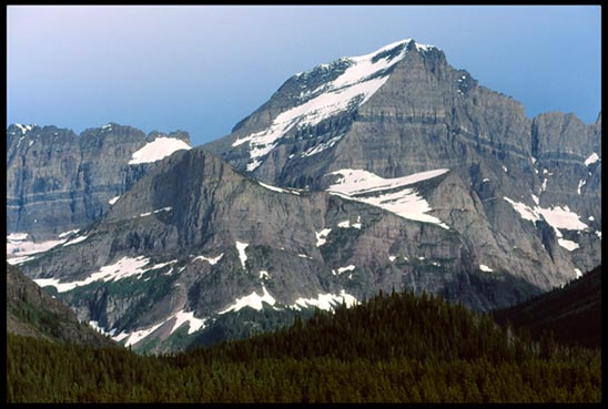 A grey mountain benneth a grey sky in Waterton Lakes National Park, Canada to represent the mountain of God's Word
