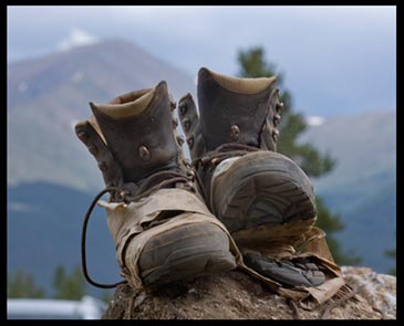 A well worn pair of hiking boots. When we walk up the mountain of God's Word we will wear out our Bibles