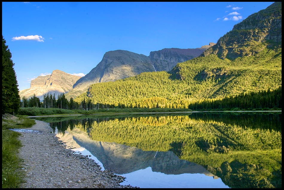 Mountain reflect in a lake in Glacier National Park, Montana and 1 Chronicles 16:8-10