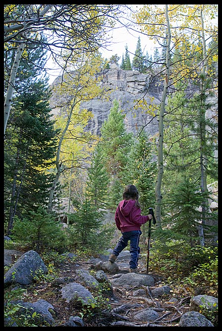 A little girl hiking a rocky trail in autumn, Rocky Mountain National Park, Colorado and Psalm 143:8 Bible verse listen and follow
