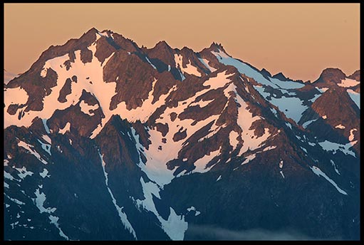 Sunrise on Mount Carrie of the Olympic Range in Olympic National Park. Mountains reveal the greatness of God