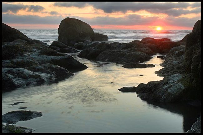  A sunset of the rocky shore of Olympic National Park, Washington State and Bible verse Matthew 11:28 and a sabbatical 