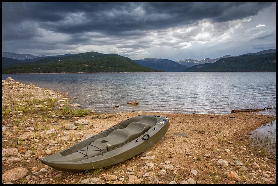 Kayak on the shore of Turquoise Lake with storm clouds over the lake, San Isabel National Forest, Colorado and Luke 5:4 and Bible Verse listen to Jesus