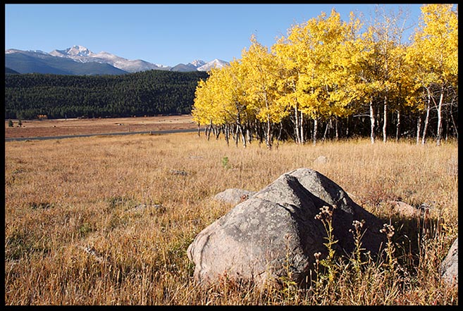 A large boulder and yellow fall aspen trees in Moraine Park with Longs Peak in the background, Rocky Mountain National Park, Colorado and Ephesians 2:19-20. Christ Jesus Himself being the cornerstone