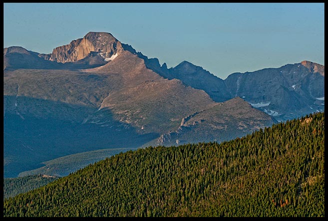 The grey granite rock of Longs Peak under a cloudless blue sky, Rocky Mountain National Park, Colorado. Bible Verse of the Day Psalm 43:3 and 