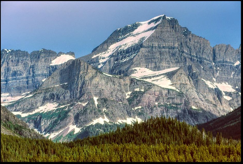 Mount Gould very rugged, granite grey mountain in Glacier National Park, Montana. Bible Verse of the Day: Isaiah 33:5, 6, the stability of our time