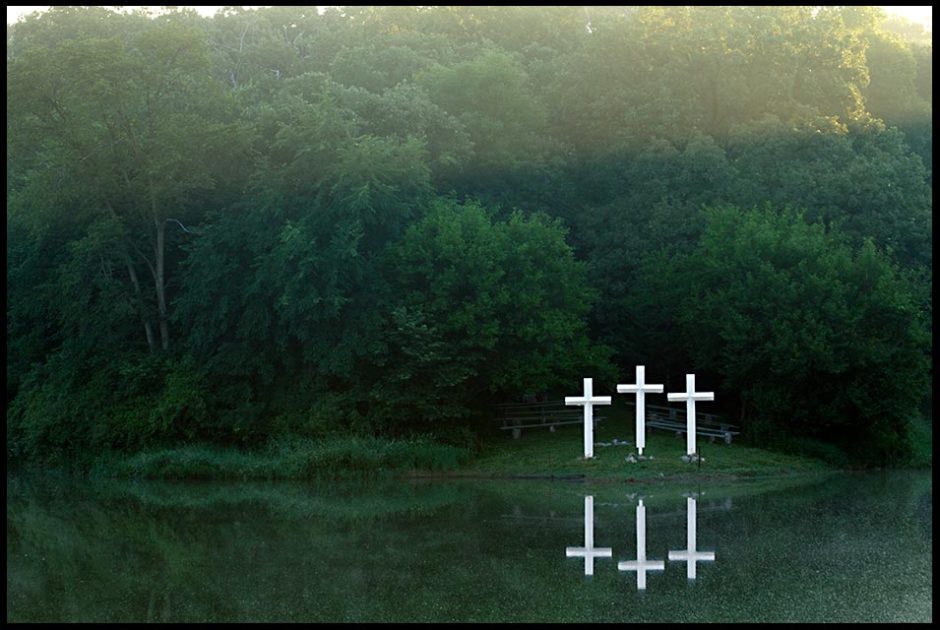 Three crosses on lake shore at sunrise, Camp Luther, Colfax County, Nebraska and Mark 15:46-47. The empty cross: