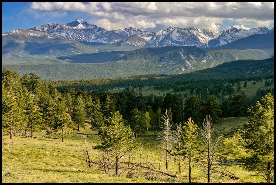A snow capped Longs Peak and Upper Beaver Meadows in springtime and Go Tell it on the Mountain
