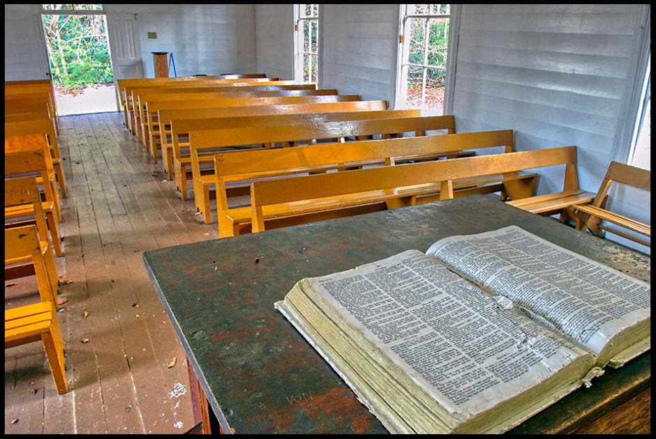 An old Bible in an old church, Great Smoky Mountains National Park, North Carolina. 2 Timothy 3:16 the red letters and all scripture is God breathed