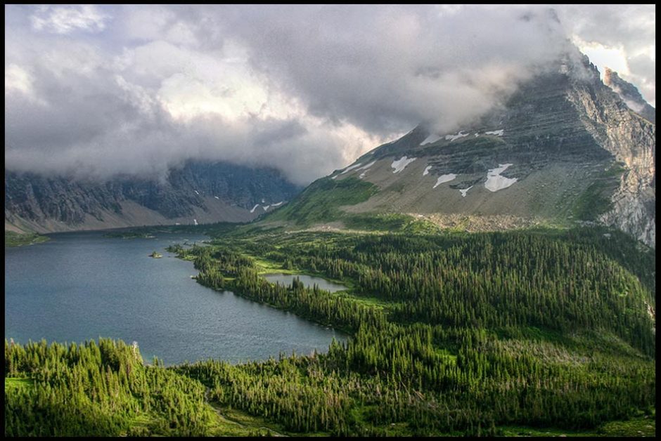 Bearhat Mountain and Hidden Lake surrounded by clouds in Glacier National Park, Montana and Psalm 62:6-7 Bible verse and landscape photo, God my rock