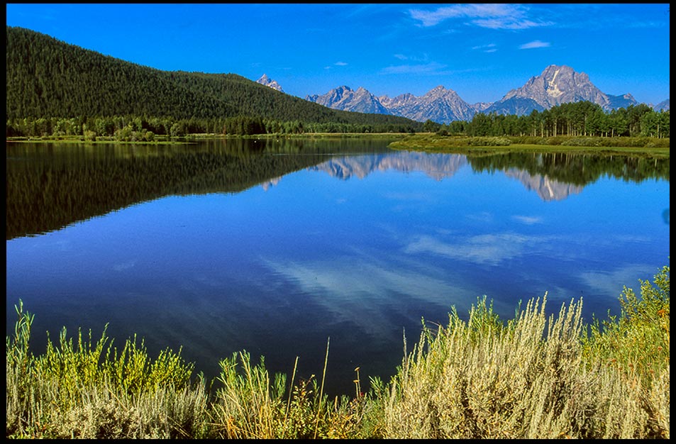 Mount Moran reflects in the water of the Ox Bow Bend, Grand Teton National Park, Wyoming and Isaiah 40:12-13a God is great