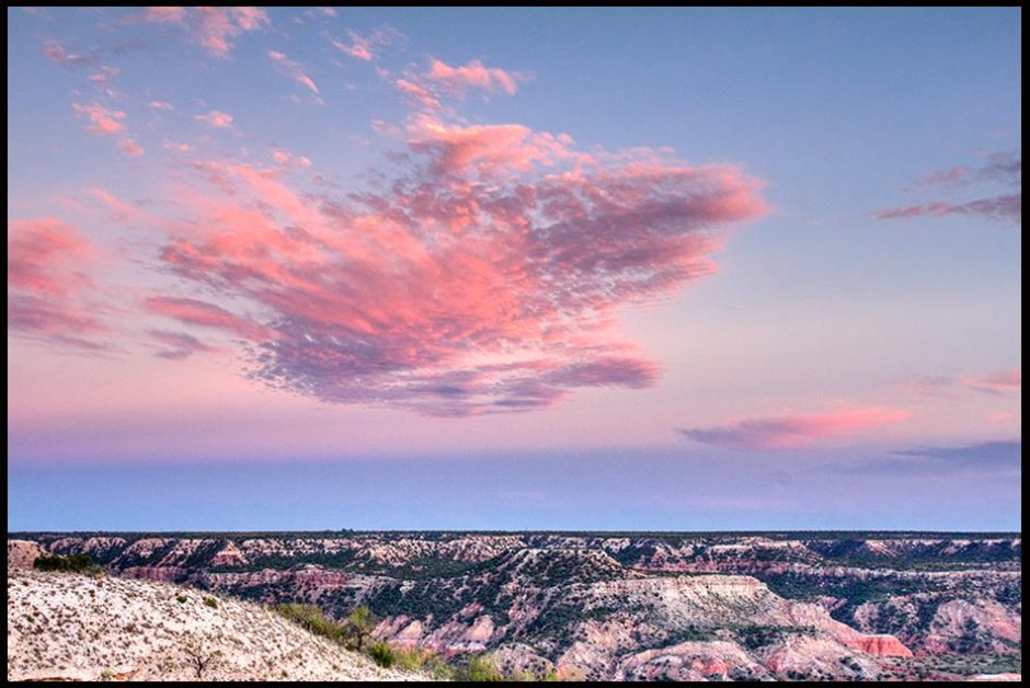 Very red sunset clouds over Palo Duro Canyon, Texas. and Psalm 104:2-3 landscape photo and Bible Verse about a cloak of light