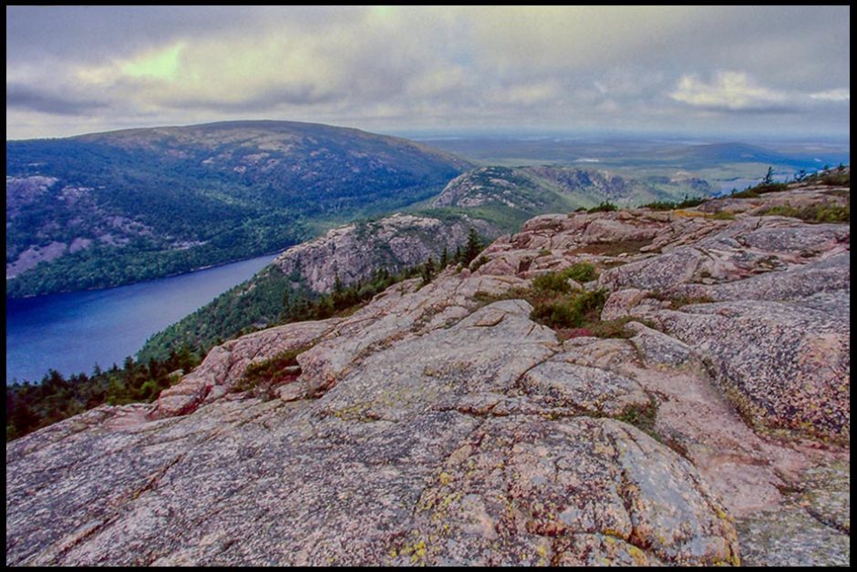 A view of the Acadia coastline from one of its granite top peaks, Acadia National Park, Maine. Bible Verse of the Day: Psalm 97:1-2 Distant shores rejoice