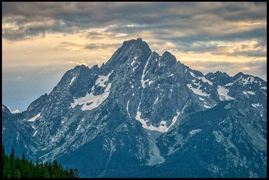 The sunsets behind Mount Moran, Grand Teton National Park, Wyoming and Isaiah 66:1 Bible verse the earth is my footstool