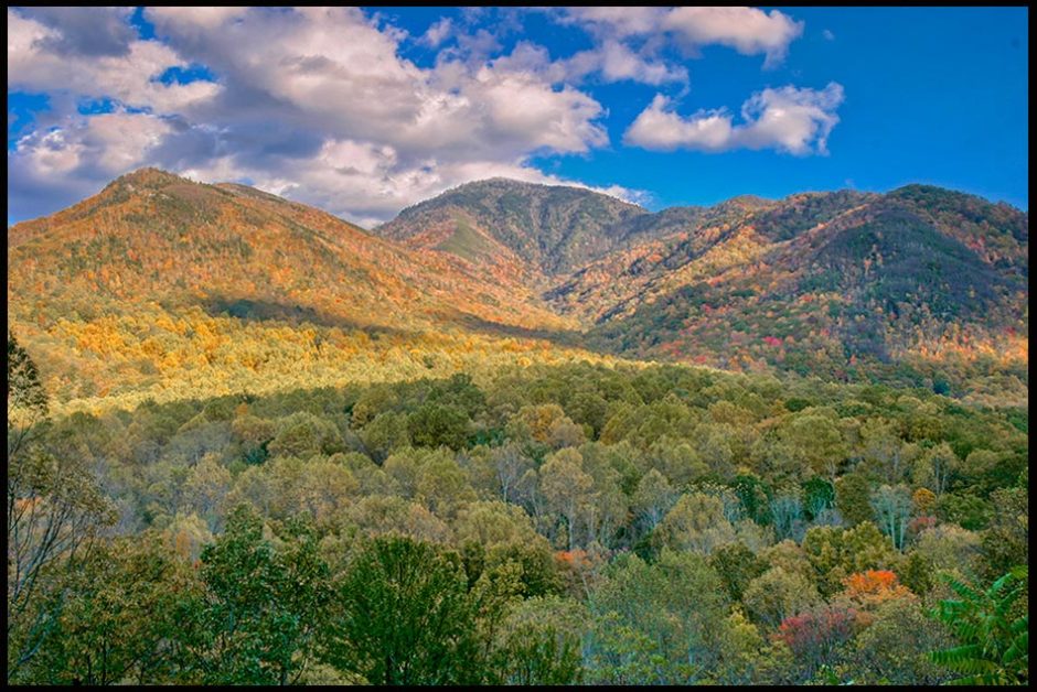 Green trees and fall colors dot the landscape of Great Smoky Mountains National Park, Tennessee and Psalm 121:1-2. "I lift up my eyes