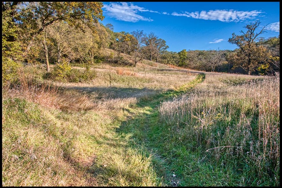 A path through a meadow in early fall under a blue sky, Hitchcock Nature Center, Iowa. Wisdoms Pleasant Ways
