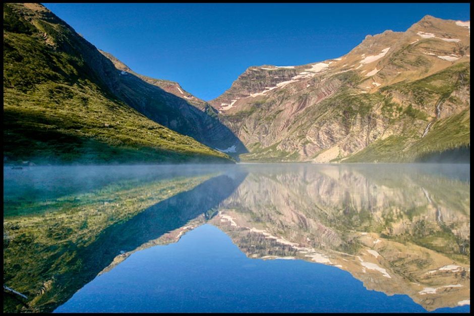 Mountains and blue sky reflected in Gunsight Lake, Glacier National Park, Montana and Psalm 27:4. "the ouse of the Lord