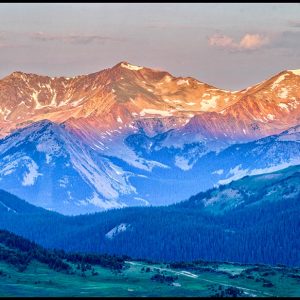 The Never Summer Mountain Range at sunrise in Rocky Mountain National Park, Colorado and Isaiah 52:7 bible verse our god reigns