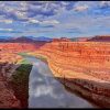 Puffy clouds and blue sky and red cliffs above the Green River from the White Rim Road, Canyon Lands National Park, Utah and Isaiah 41:18 Bible verse Springs in the Midst.