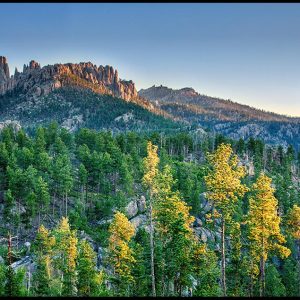 The Pinnacles rock formation above the surrounding landscape at sunrise, Black Hills, South Dakota. Bible Verse of the Day: Acts 17:24-25. The God who made the world