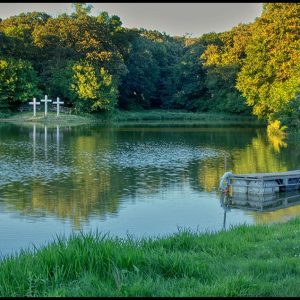 Three crosses by a lake at Camp Luther, Colfax County, Nebraska and Hebrews 12:2 Bible verse on fixing our eyes on Jesus