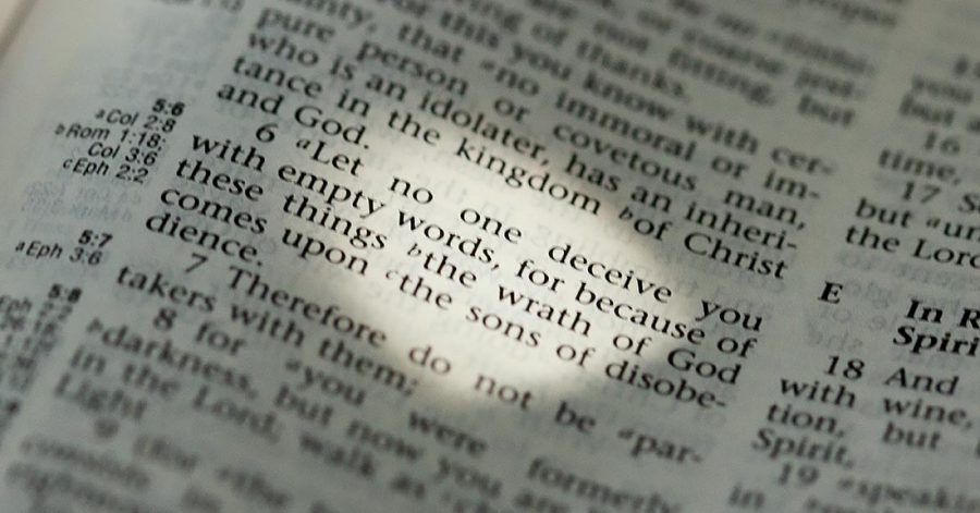 An open Bible Page to the verse Ephesians 5:6 about the need for truth and discernment.