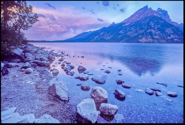 Purple storm clouds above Jenny Lake and Mount Teewinot at sunrise, Grand Teton National Park, Wyoming and Colossians 1:16 Bible verse God created heaven and earth