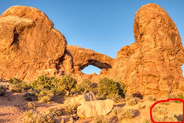 Photograph of one of the Windows in Arches National Park with the photographer's shadow in the lower, right corner. This photo is to illustrate eliminating our shadows in our photographs.