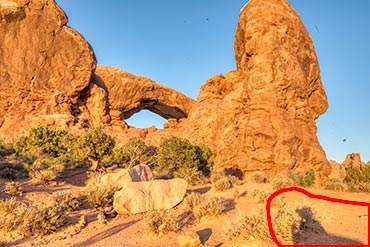 Photograph of one of the Windows in Arches National Park with the photographer's shadow in the lower, right corner. This photo is to illustrate eliminating our shadows in our photographs.